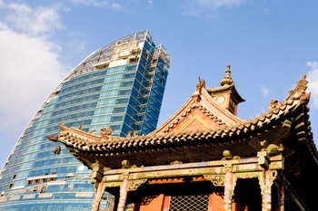 Featured is a photo that shows the juxtaposition of the old against the new in modern-day Asia.